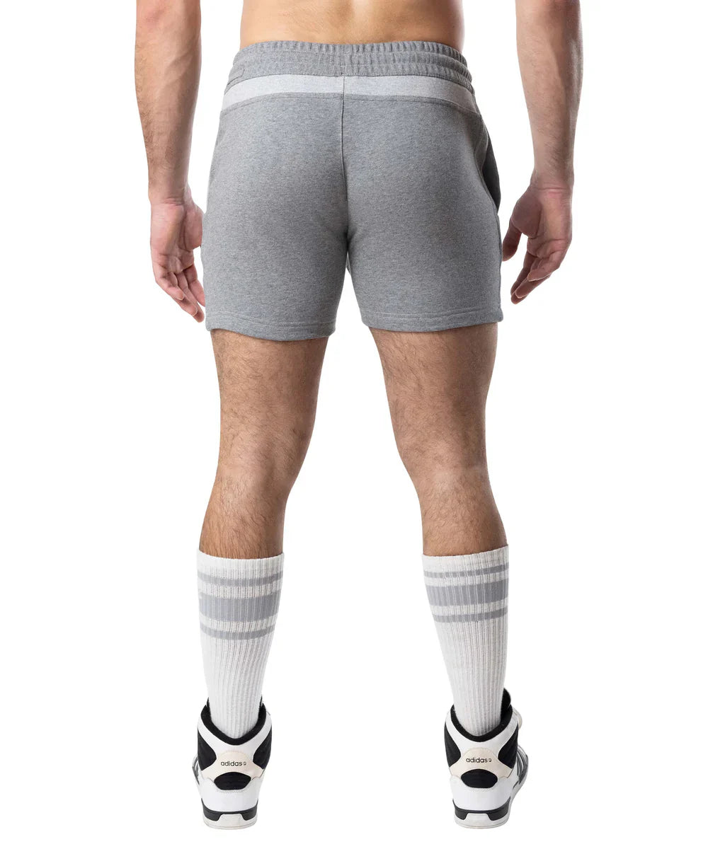 Gray heathered Nexus rugby short with white elastic waistband and side pockets made of soft sweatshort material