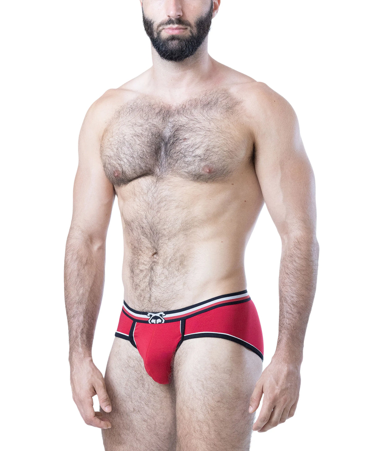 Red U-front brief with black and white accents worn by a model with a muscular build showcasing a snug fit and soft fabric. By Nasty Pig