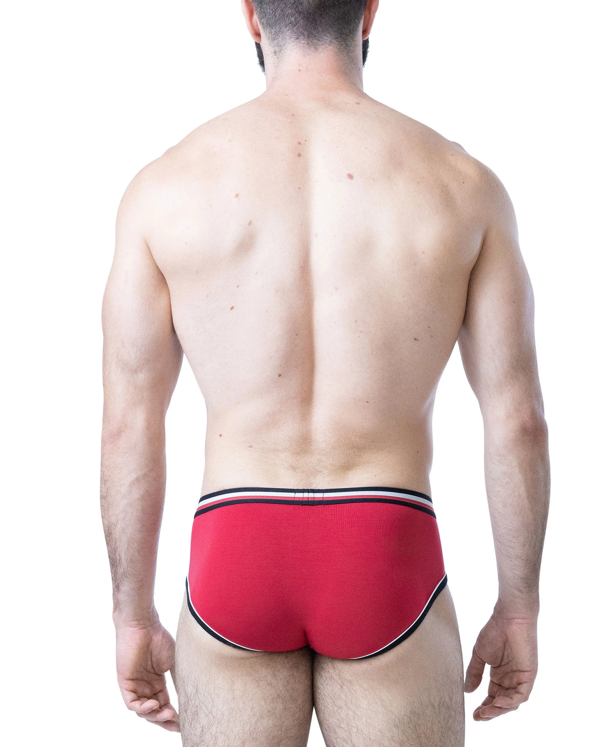 Model wearing red U-front briefs with black and white trim showcasing a snug fit and sporty design by Nasty Pig