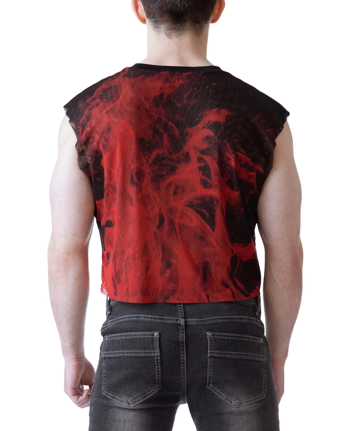 Model wearing a sleeveless crop top with a flame design in red and black paired with dark jeans by Nasty Pig