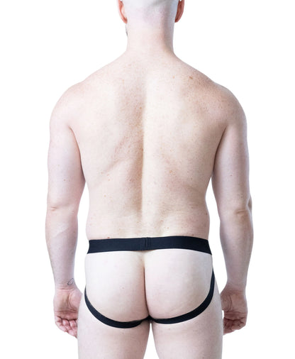 Black jockstrap with minimal coverage featuring a comfortable waistband worn by a model from behind by Nasty Pig