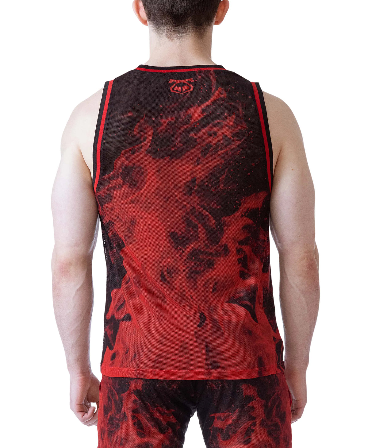 A model wearing a red and black tank top with a flame pattern featuring a mesh material and the Nasty Pig logo on the back