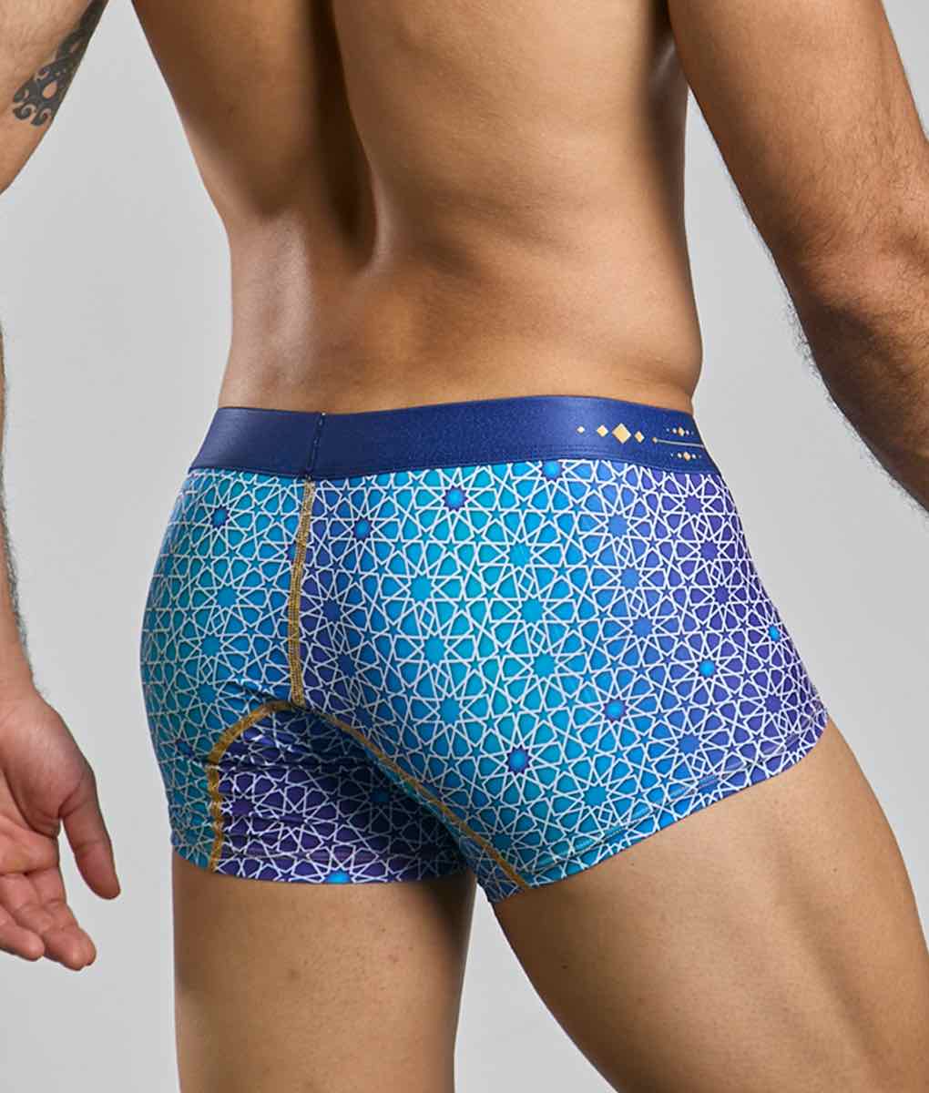 Blue and purple geometric patterned men’s boxer briefs with navy waistband from new malebasics trunk hipster collection