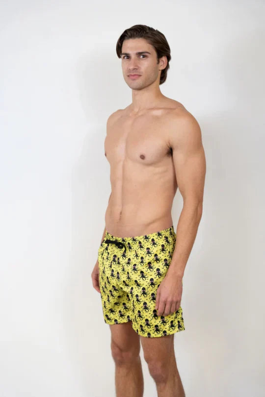 Bright yellow octopus print swim shorts with repeating black pattern perfect for beachwear and swimming
