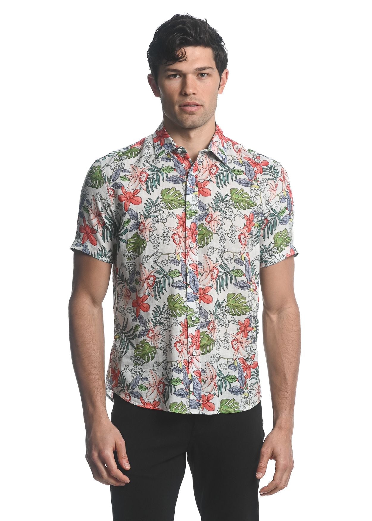 A men’s short-sleeved button-up shirt with a vibrant tropical floral pattern in red green and pink on beige Tencel linen
