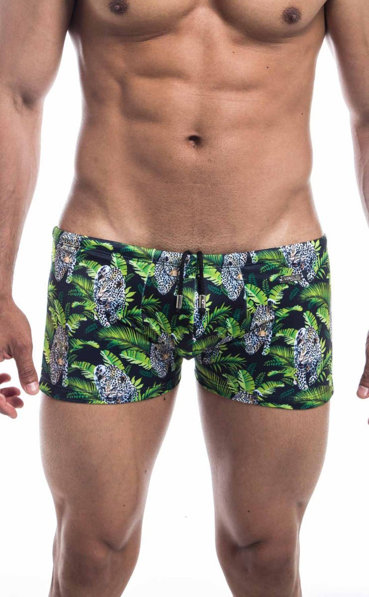 Oceanico square cut swim trunks in green and black with vibrant jungle pattern featuring leopards and tropical leaves