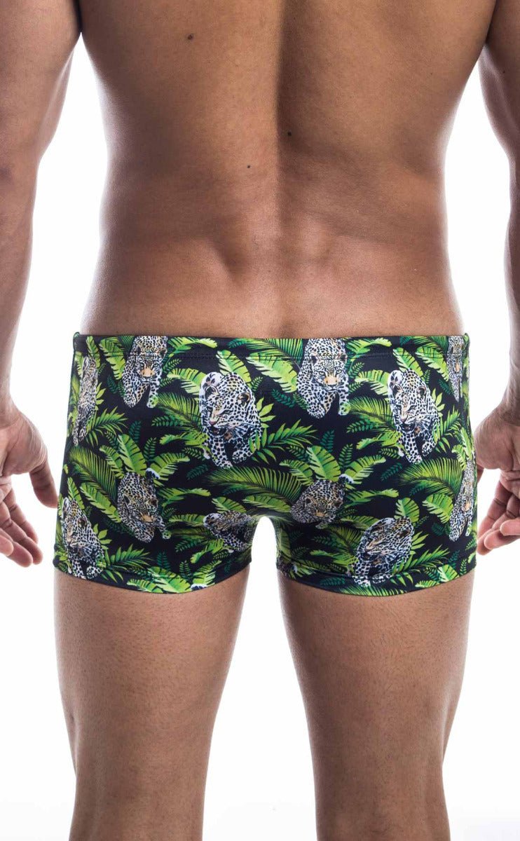 Oceanico square cut green and black swim trunks with vibrant tropical leopard and foliage pattern for beachwear