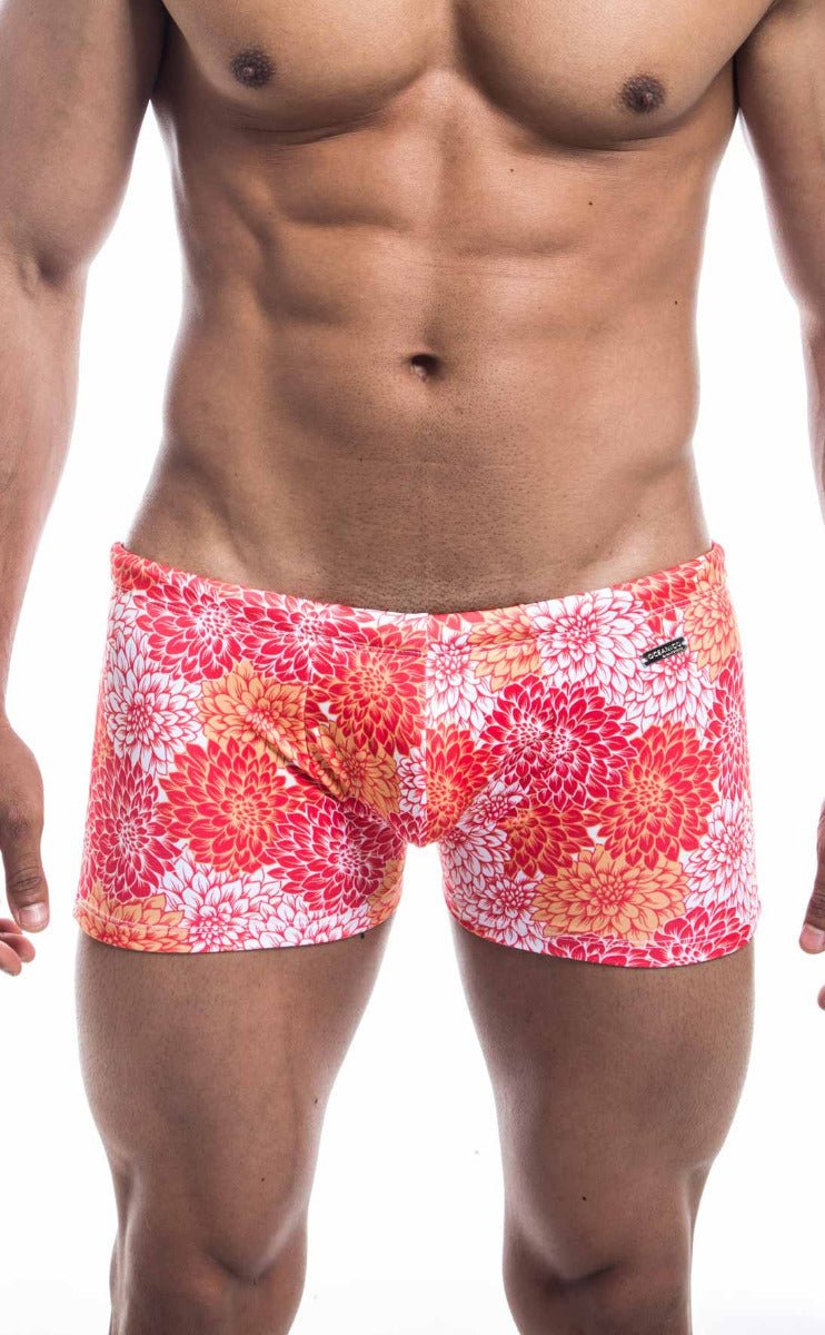 Oceanico square cut swim trunks with vibrant pink red and orange floral pattern perfect for beachwear