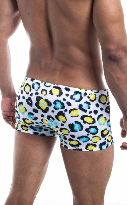 Oceanico square cut white swim trunks with bold leopard print featuring yellow and teal spots for beachwear