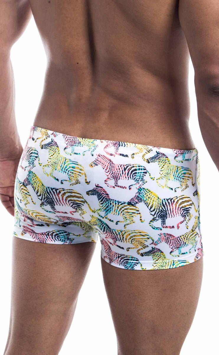 White swim trunks oceanico square cut with vibrant rainbow zebra pattern perfect for beach and pool use