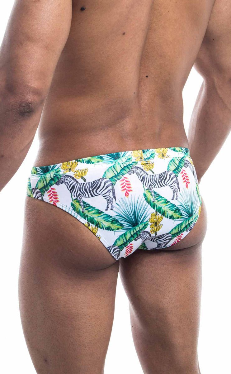 Oceanico swim bikini white swim trunks with vibrant tropical pattern featuring zebras green palm leaves and pink flowers