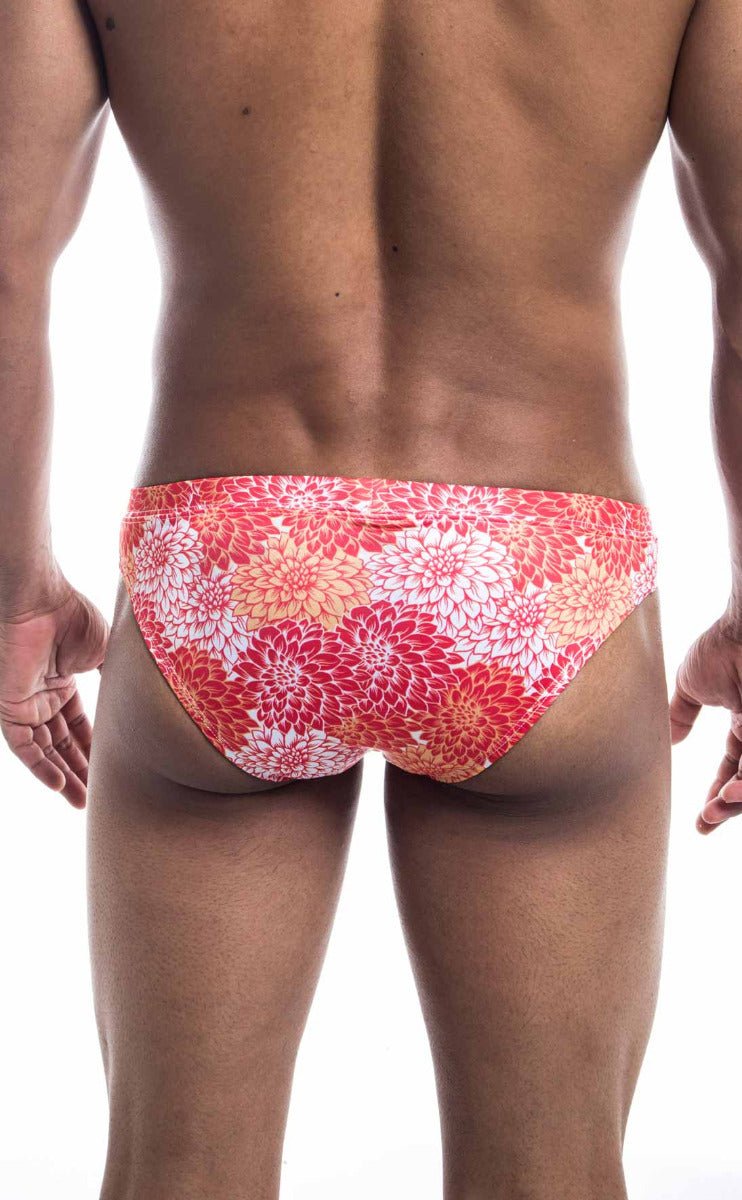 Oceanico swim bikini featuring vibrant coral and white floral-patterned swim trunks ideal for beachwear