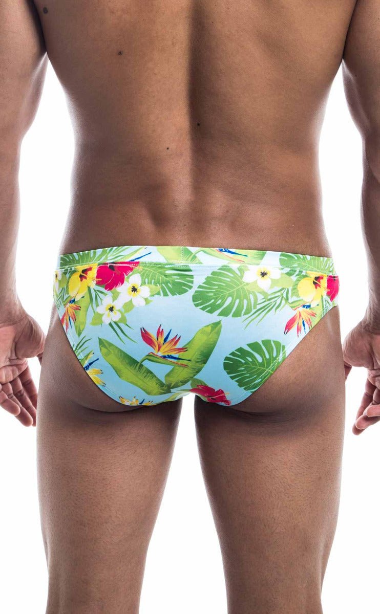 Oceanico swim bikini brightly colored tropical print swim trunks in light blue with green leaves and red yellow flowers