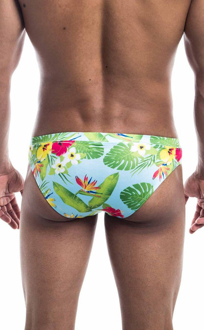 Oceanico swim bikini brightly colored tropical print swim trunks in light blue with green leaves and red yellow flowers