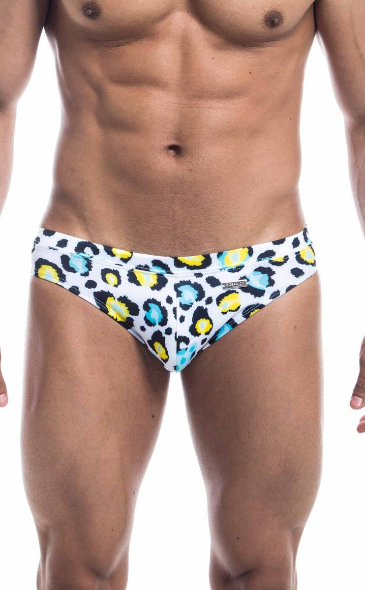 White swim trunks from oceanico swim bikini featuring vibrant leopard print with yellow and blue spots