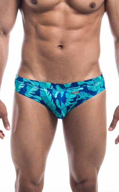 Oceanico swim bikini featuring vibrant turquoise and deep blue tropical leaf-patterned swim trunks
