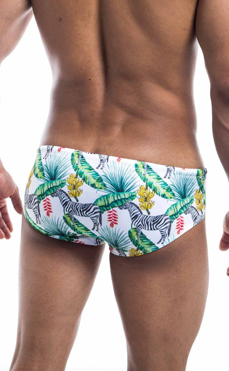 Oceanico swim brief white swim trunks with vibrant tropical pattern of green palm leaves yellow bananas and zebras