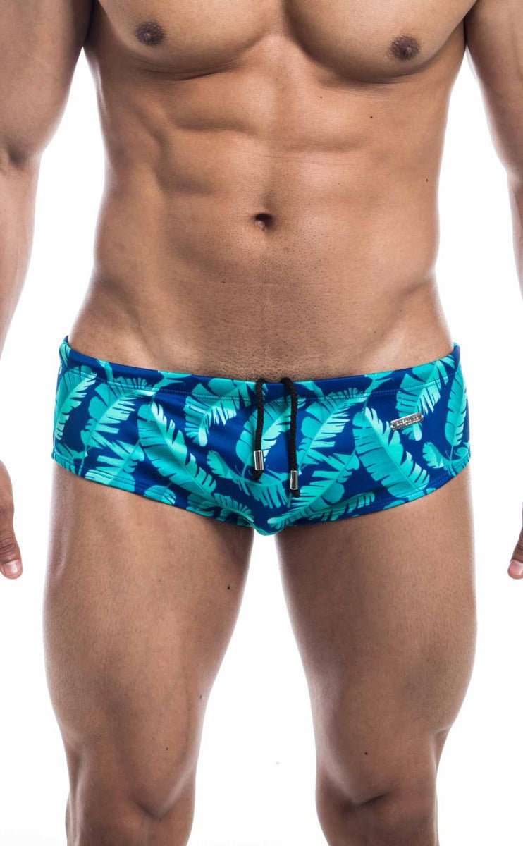 Oceanico swim brief with vibrant turquoise and navy tropical leaf pattern and black drawstrings for beachwear