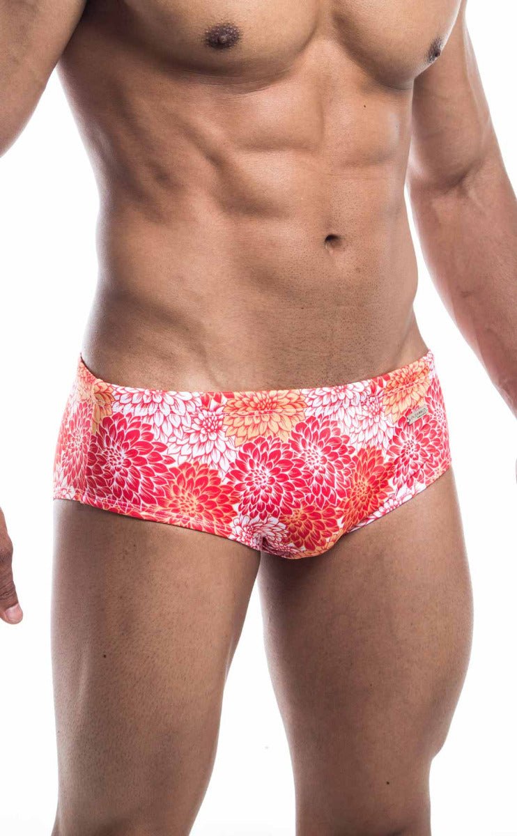 Oceanico swim brief with vibrant pink orange and white floral pattern designed for comfortable beachwear