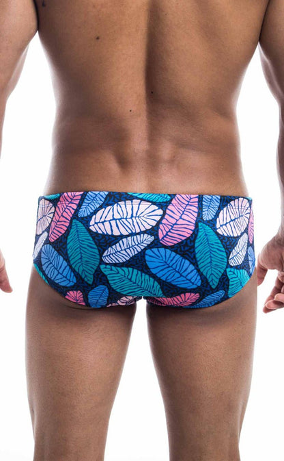 Oceanico swim brief featuring vibrant leaf-patterned trunks in blue pink and white on a dark navy base