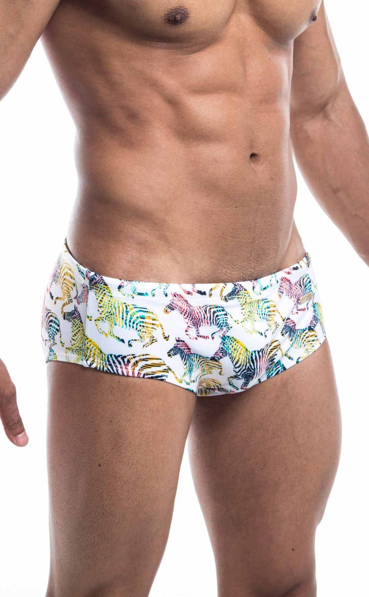 White Oceanico swim brief with vibrant multicolored zebra print pattern ideal for beach and pool use