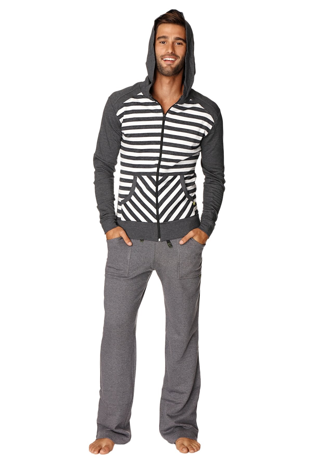A man wearing a charcoal stripe original limited edition form-fit crossover yoga track fleece hoodie with geometric patterns