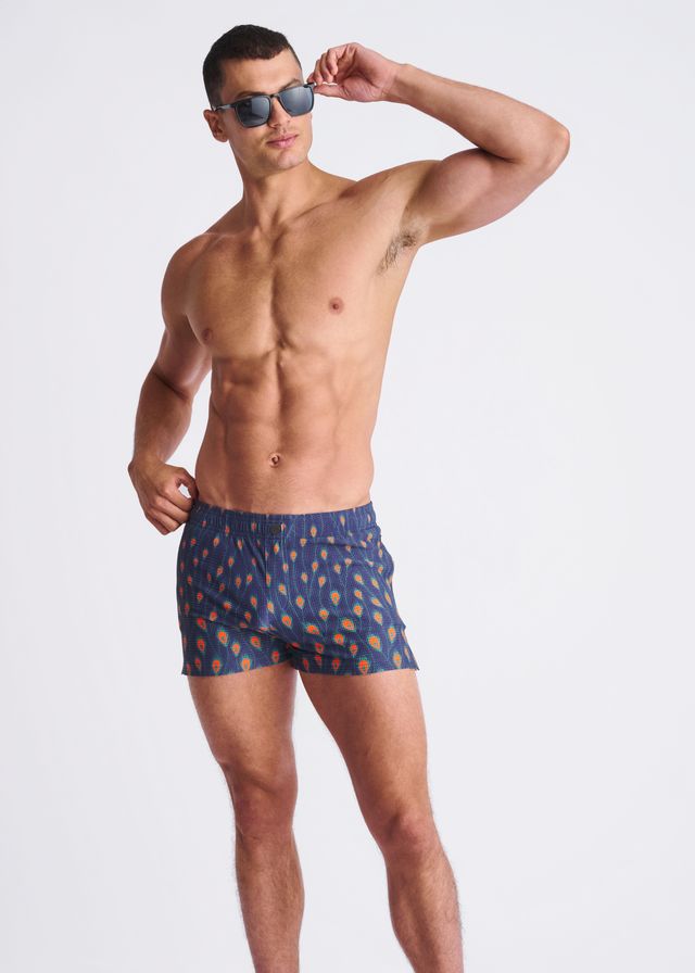 Peacock feathers seersucker blue swim shorts with mesh lining featuring orange and yellow ice cream cone pattern
