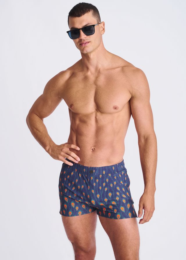 Blue peacock feathers seersucker swim shorts with orange and yellow feather pattern and mesh lining