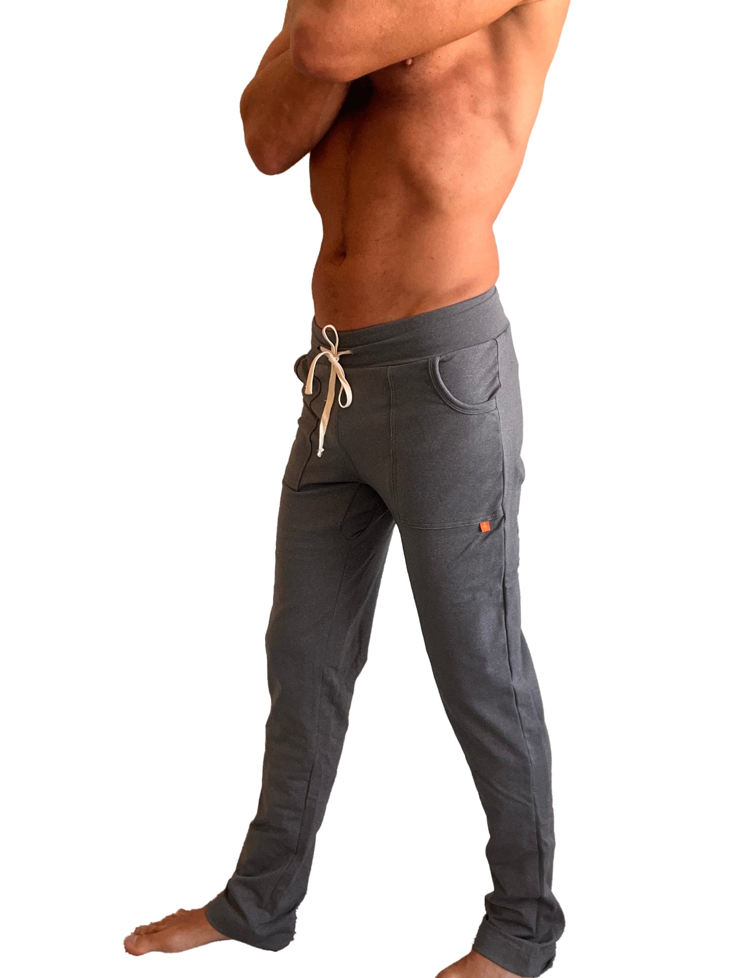 Performance premium track and lounge sweat pant in dark heather grey with drawstring waist side pockets and orange tag on thigh