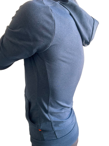 Performance-premium form-fit crossover yoga track hoodie in dark blue heathered fabric with subtle texture and orange tag