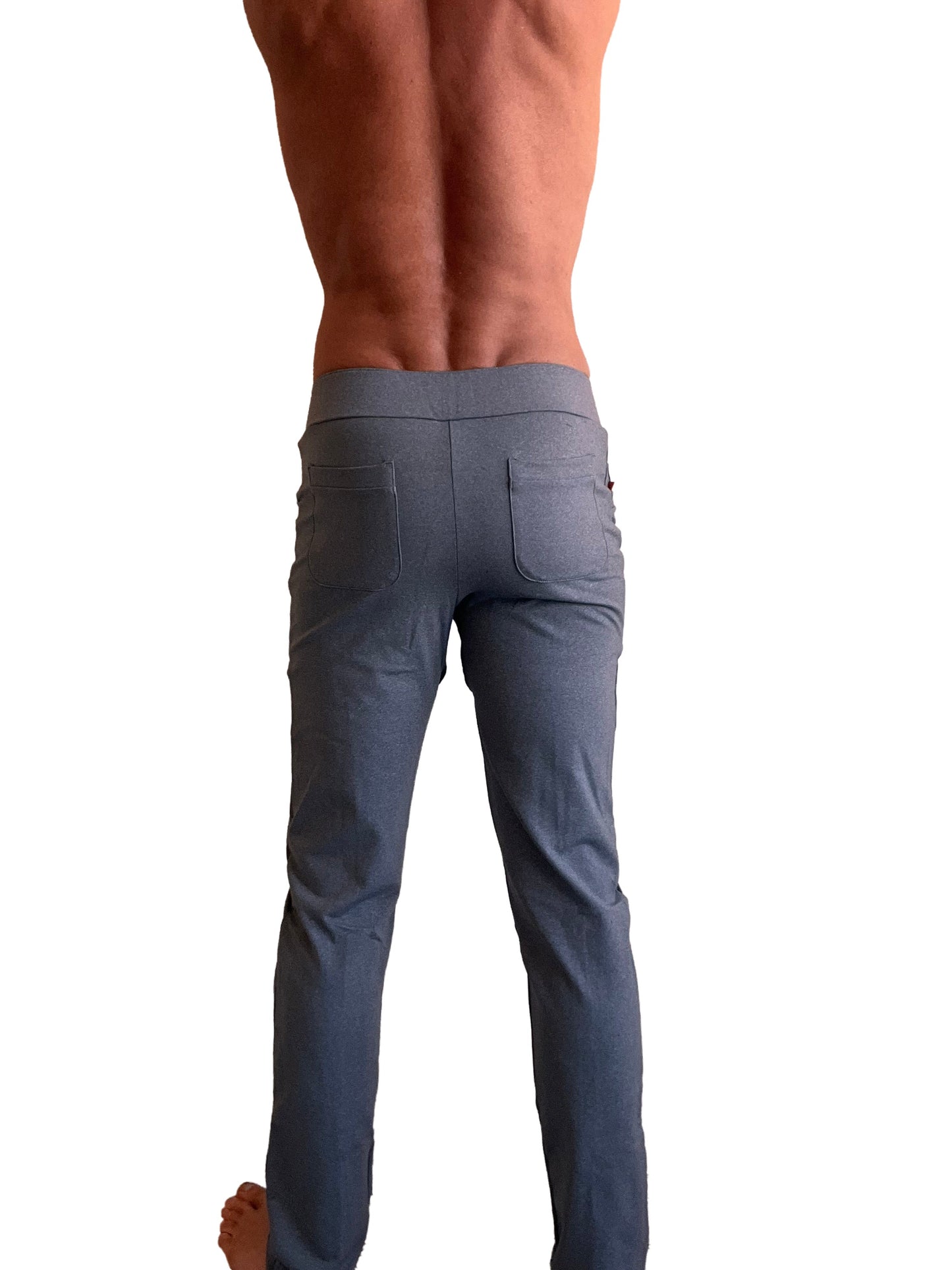 Performance-premium tactical urban dress pant in dark grey heather with slim fit, smooth modern fabric, and subtle stitching details