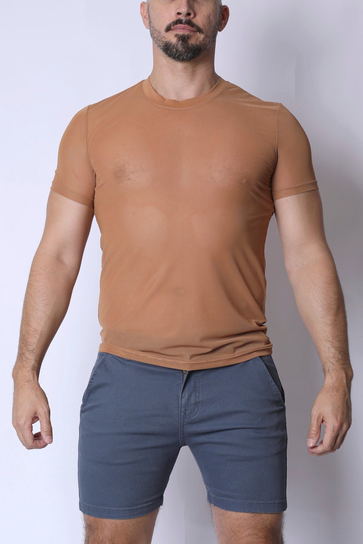 A fitted tan phantom mesh t-shirt with short sleeves and crew neck made from breathable material