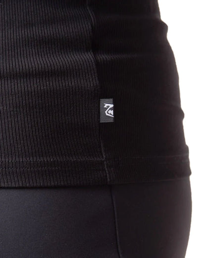 Black ribbed knit pig rib tank top with small rectangular brand tag on the seam showing the front side