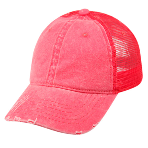 A vibrant coral pink pigment dyed washed cotton trucker cap with distressed front and matching mesh back