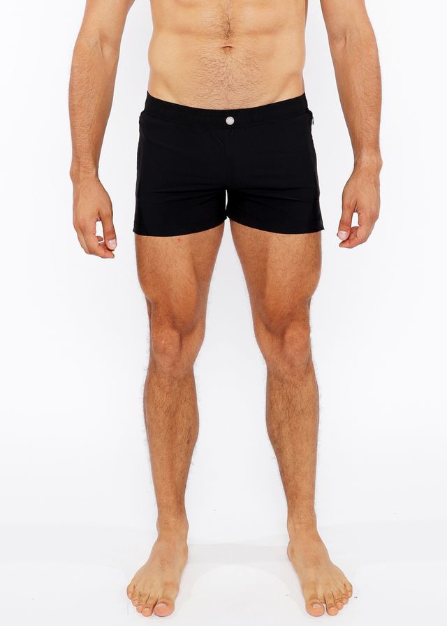 Black pinstripe swim short with a single white button at the waistband made for beach and pool use