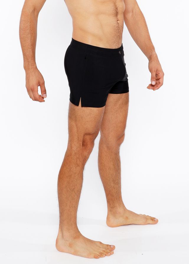 Black pinstripe swim short with sleek form fitting design and subtle side slits for athletic performance