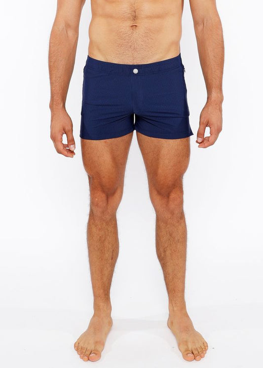 Navy blue pinstripe swim short with white button closure designed for comfortable beach and poolwear
