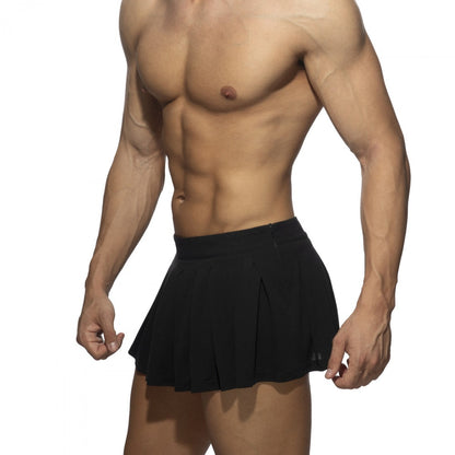 Black pleated ring skirt styled as high-waisted athletic shorts with side zipper detail for active wear