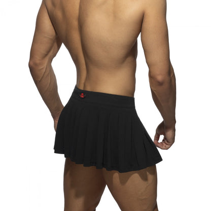 Black pleated ring skirt featuring a red logo on the waistband made from lightweight fabric for stylish wear
