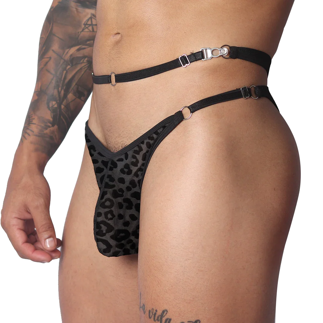Black leopard-print plush jockstrap featuring thin elastic waist straps, metal rings, and adjustable metal hardware.