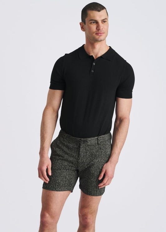 Black chalk stripe jacquard stretch knit chino shorts paired with a black polo shirt.