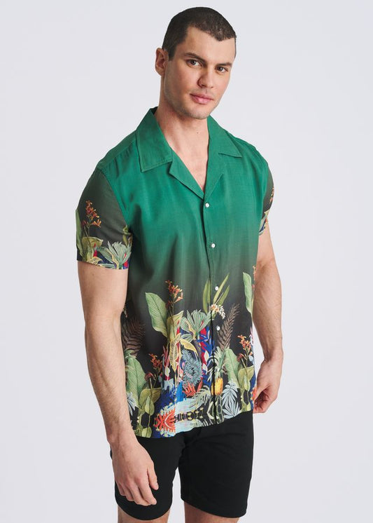 Green short-sleeve button-down shirt with a camp collar, fading to black at the bottom with a vibrant tropical floral print.