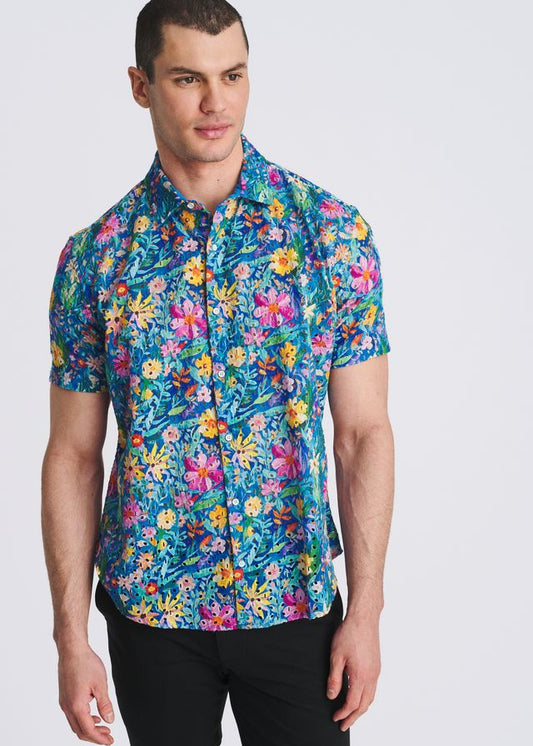 Cobalt blue short-sleeve button-down shirt with a vibrant multi-color floral print.