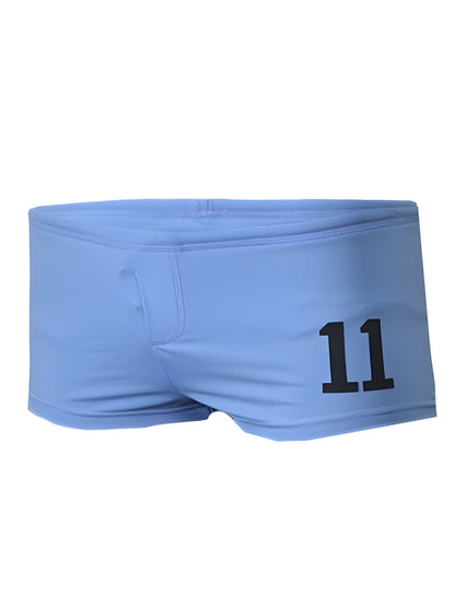 Light blue pride 11 brief swim trunks with bold black number 11 printed on the side for active swimwear use