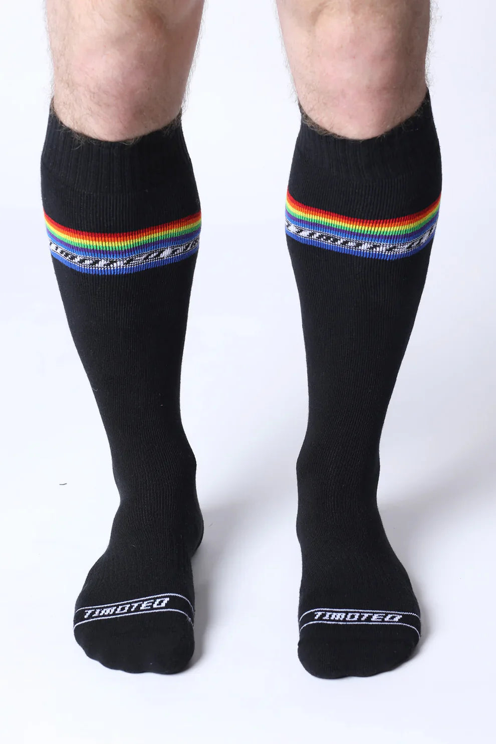 Black knee high socks with rainbow stripe and tiboteo branding designed for pride and everyday wear