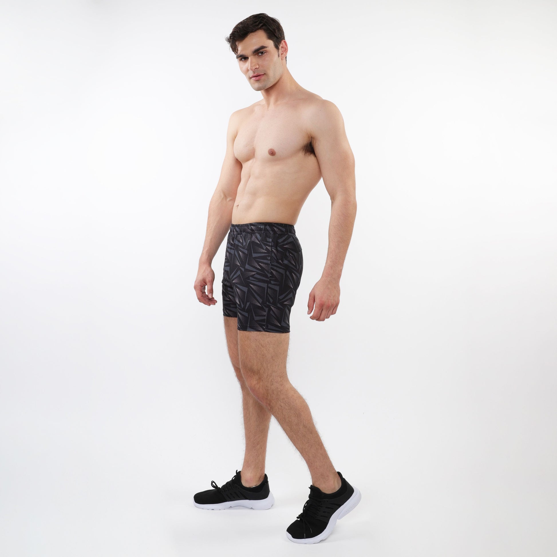 Black printed mesh stretch performance shorts with geometric pattern designed for athletic use