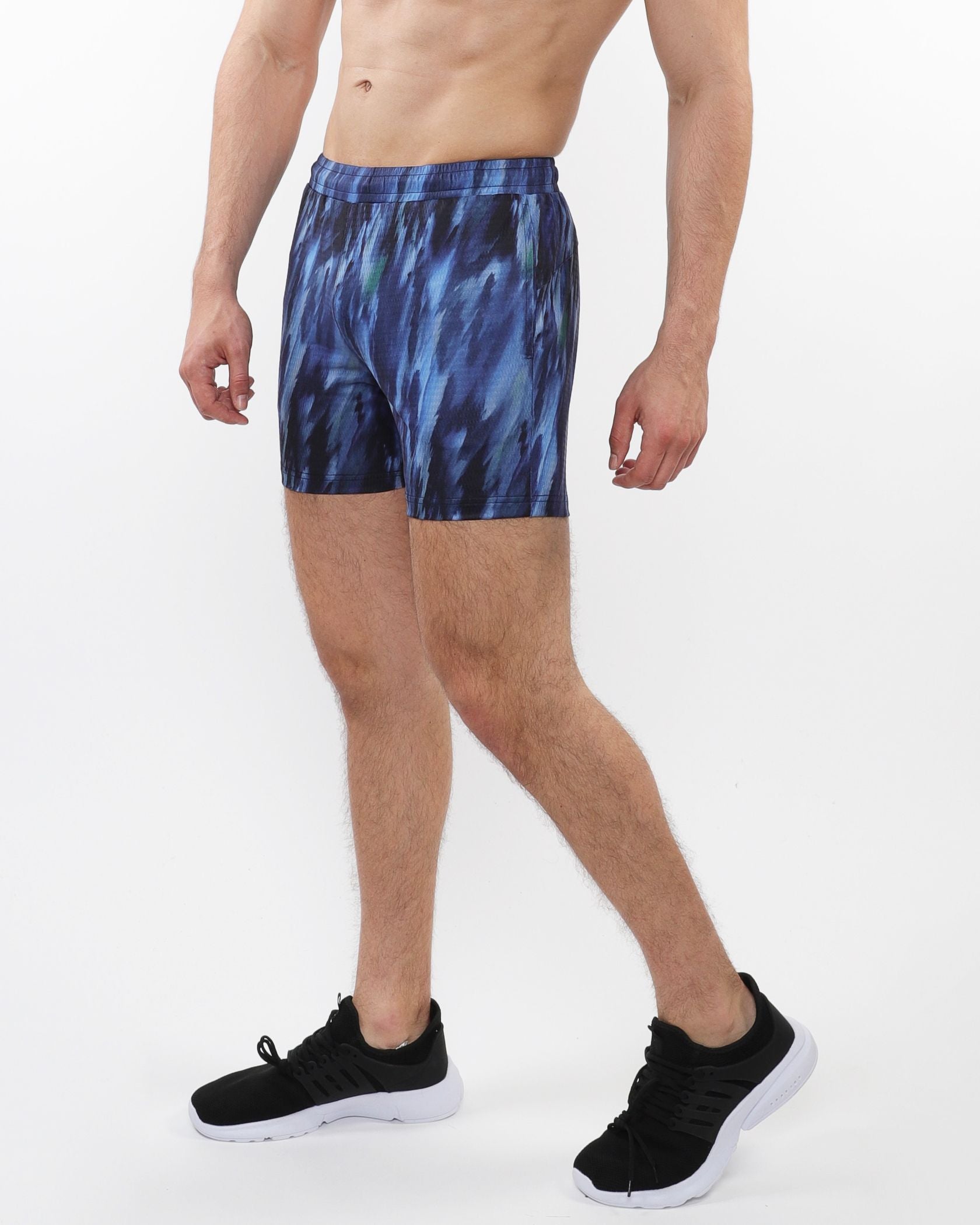Printed mesh stretch performance shorts in blue and black with an abstract athletic pattern for active wear