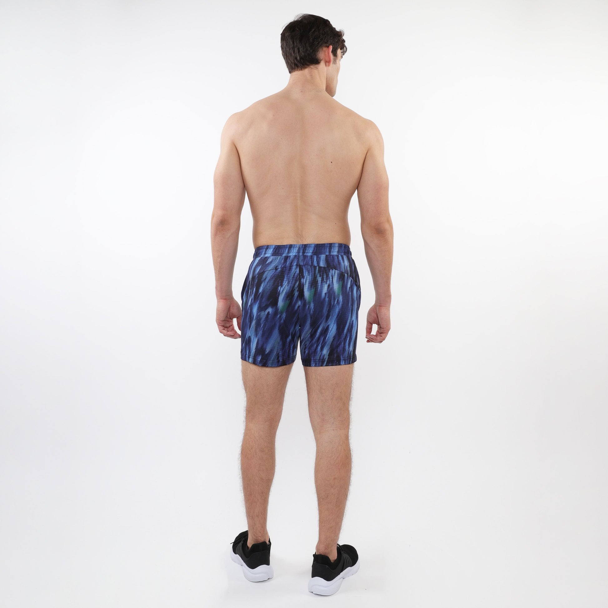 Printed mesh stretch performance shorts in blue with abstract pattern and fitted waistband for athletic use