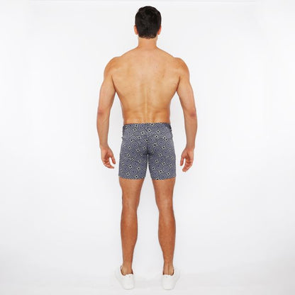 Men’s navy blue printed stretch knit swim trunks with white geometric pattern for comfortable water use