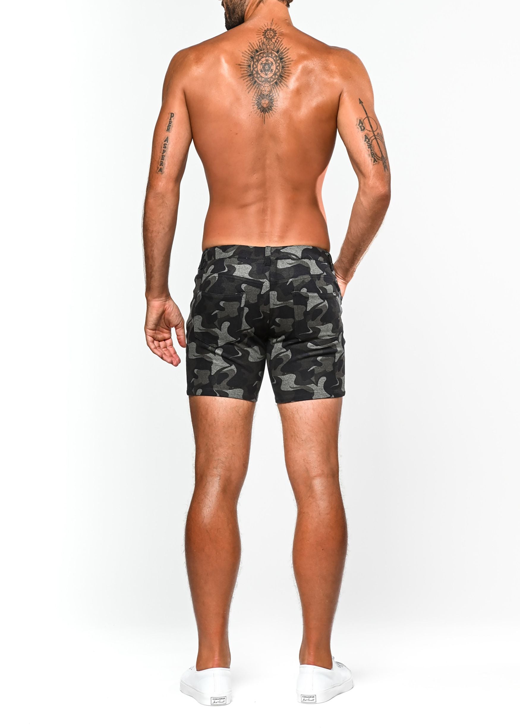 Printed stretch knit shorts in black and gray camouflage pattern made from flexible knit fabric for casual wear